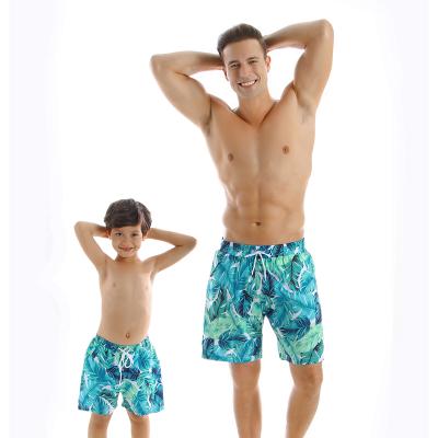 China 2021 new color printing parent-child solid bikini men's breathable blue printing slit swimwear bikini swimming trunks children's shorts for sale