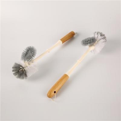 China Sustainable Wholesale Wall Mounted Type Eco-friendly Kitchen Wooden Handle PP Plastic Long Cleaning Bottle Brush for sale