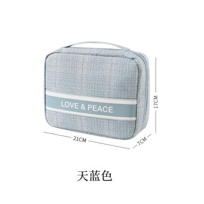 China Fashoion 2021 New Arrival Custom Geometric Lattice Toiletries Storage Bag Women Travel Fashion Clutch Belt Mini Makeup Cosmetic Bags for sale