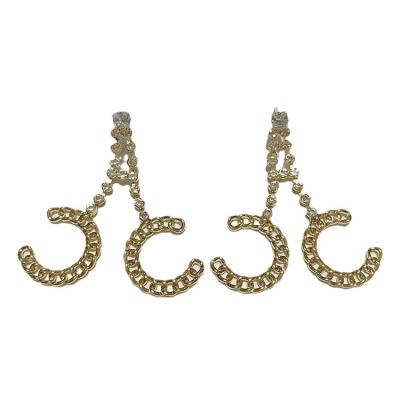 China Douyin S925 needle double C-letter metal friendly silver chain earrings temperament single rhinestone stud earrings for sale