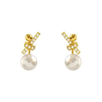 China 2021 New Personality Friendly 925 Bow Pearl Silver Earrings Korean Temperament Metal Pearl Earrings Jewelry Wholesale for sale