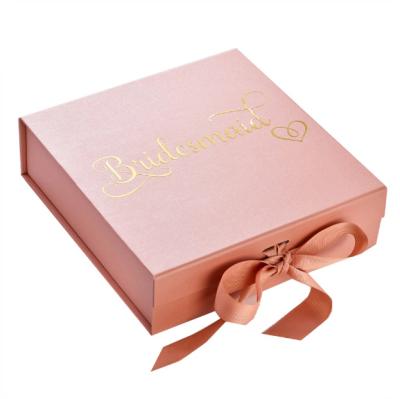 China Recyclable Pink Luxury Clothing Packaging Boxes Folding Gift Box Paper Packaging With Ribbon for sale