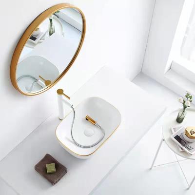 China Art European Modern Solid Outdoor Bathroom Modern Design Lavatory Style Kit Lavatory White Gold Ceramic Sinks for sale