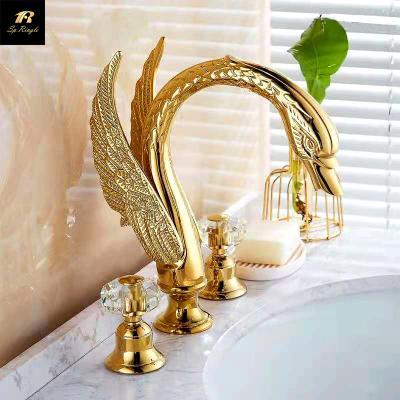 China European Luxury Spool 3 Faucets Wear Resistant Double Hole Handle Metered Deck Mounted Gold Swan Faucet Brass Sink Bathroom for sale