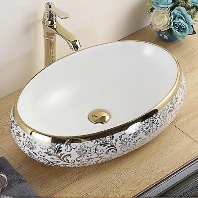 China Contemporary Electroplate Oval Basin Art Ceramic Flower Countertops Gold Color Hand Sink Bathroom Vanity for sale