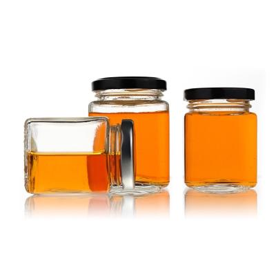 China Toughness Durable Using Low Price Food Grade Custom Round Empty Glass Honey Jar for sale