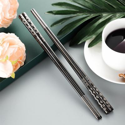 China High Quality Rustic Black Laser Pattern Handle Stainless Steel Chopsticks Chopsticks Set for sale