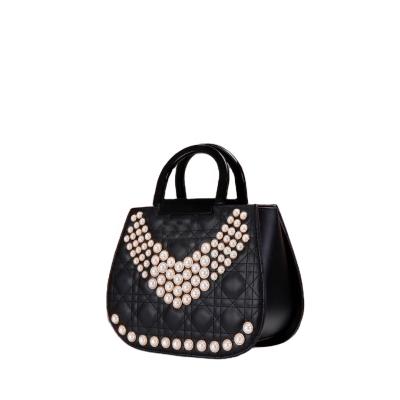 China Fashion eye-catching bags fashion pearl decorate handbags lightweight luxury female bags good quality factory direct sales for sale