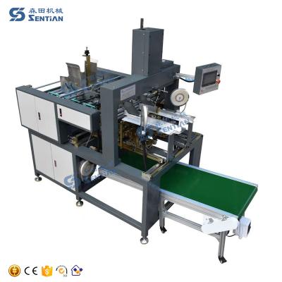 China Items Wy-65 Plc Control Table Gluing Machine 4 Corner Box Corner Pasting Gluing Machinery zu verkaufen