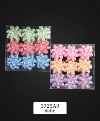 China Plastic Metallic/Holographic/Iridescent/PP/Luster/Printed ribbon factory price star burst quality export plastic bow,beautiful pure color star bow for sale