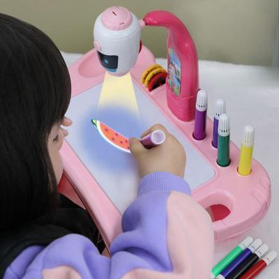 China Early Childhood Enlightenment Amazon Success Kids Toy Painting Drawing Table Led Projector Musi for sale