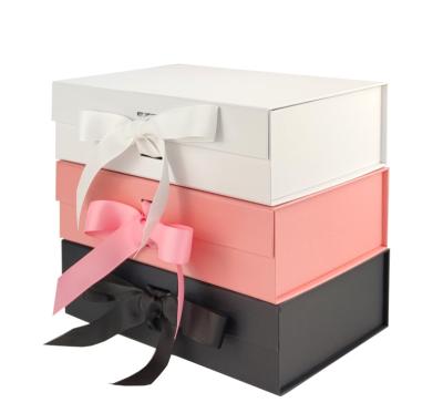 China Wholesale Exquisite Recyclable Stain Rectangular Oversized Pink Top Block Folding Magnetic Gift Boxes Packaging Gift Boxes With Ribbon Closure for sale