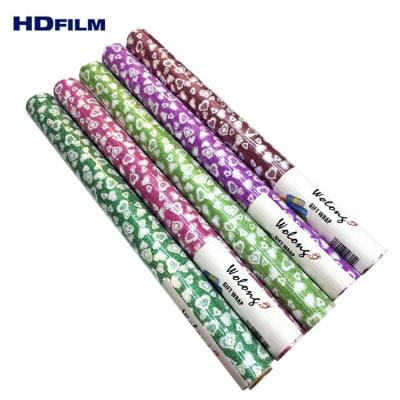 China Hot Selling Waterproof Colorful PP Glitter 50X70cm Gift Wrapping Paper Flower Wrapping Paper for sale