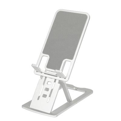 China Adjustable Ultra Thin Foldable Aluminum Phone Stand For Tablet Alloy Adjustable Phone And Phone Holder Folding Bracket For iPad iPhone for sale