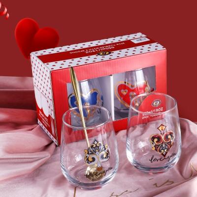 China Acceptable Wholesale Viable Stock Stemless OEM Wine Glass Cup Set 2pcs Egg Shape Glass Tumblers With Spoons For Christmas Valentine Gift for sale