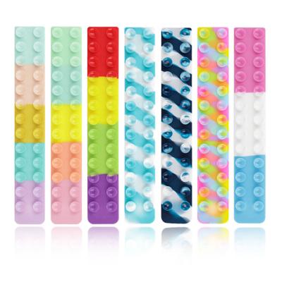 China Hot sale silicone game fidget snap pull sucker squido pops silicone sucking disc toy squidopops anti-stress toys for sale