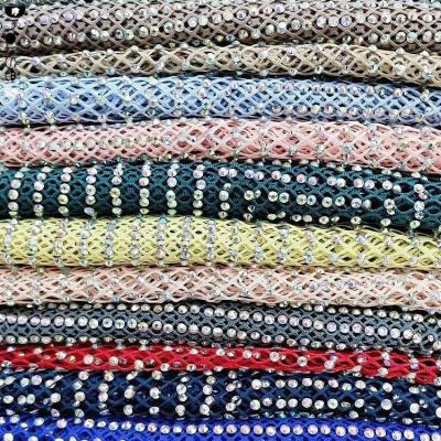 China Custom Bling Shine Dhorse Elastic Stretch Net Rhinestone Covered Fabric Bling Mesh for sale