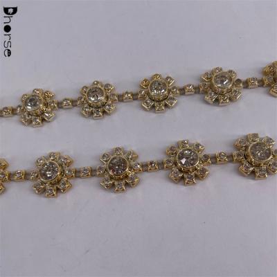 China Bling Bling Gleen Guangzhou Flower Shape Rhinestone Plastic Crystal Trim For Bag Decoration for sale