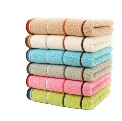 China Superdry Compressed Terry Cloth Customized Cotton Exfoliating Luxury Colorful Stripe Face Wash Towels for sale