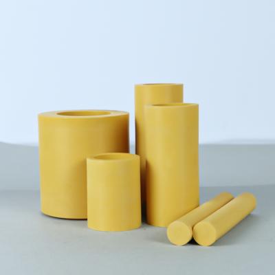 China PTFE + PU Filled PTFE Rods which uses 100% virgin pure PTFE to get PTFE semi-finished tubes in light yellow for sale