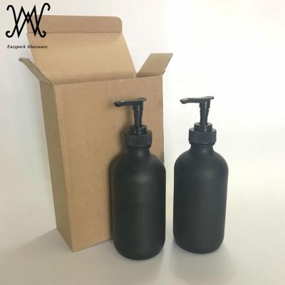 China Personal Care 16oz Matte Black Coated Glass Boston Round Bottles With Plastic Lotion Soap Shampoo Pump Dispenser for sale