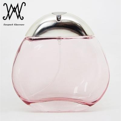 China Personal Care 100ml Round Shape Flat Oval Light Pink Glass Perfume Bottle With Mist Sprayer for sale