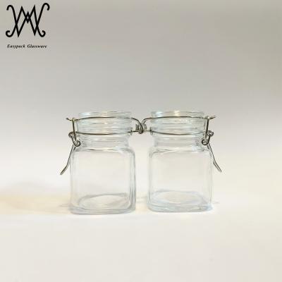 China 3oz 100ml Sustainable Square Storage Glass Jar with Airtight Glass Stopper and Rubber Seal for sale