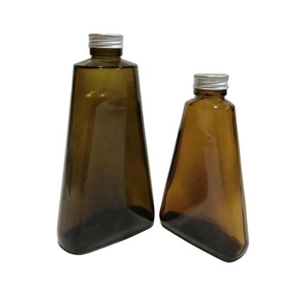 China Pharmaceutical Vitamin 320ml Triangular Shaped Amber Glass Bottle With Metal Cap for sale