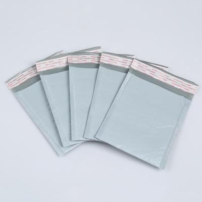 China Creatrust Strong Adhesive Material Bubble Securtiy Whip Pastel Laser UN Bubble Mailer Airtight Poly Bag for sale