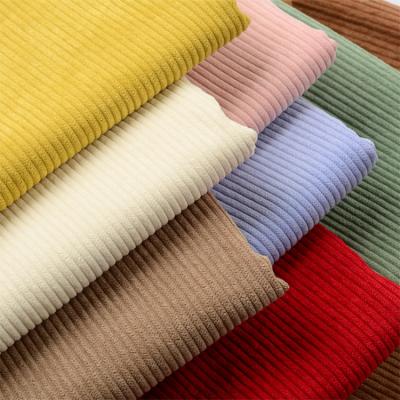 China New arrival Shaoxing RTS 100 polyester fabric 8 wale corduroy anti-static fabrics for women autumn winter apparel and upholstery for sale