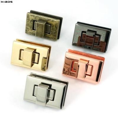 China HIBOS Metal OEM Engraved Logo Rectangle Purse Closure Twist Lock For Bags for sale