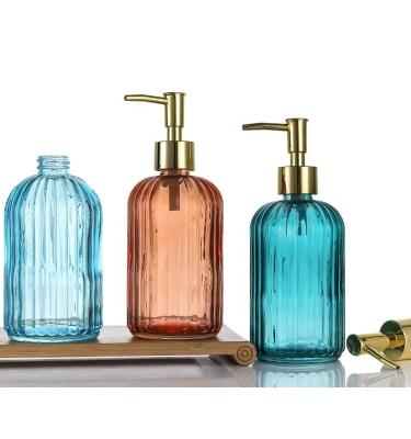 China Bathroom And Kitchen Cosmetic Round Liquid Soap Dispenser Shampoo Glass Bottle With Pump Dispenser Container for sale