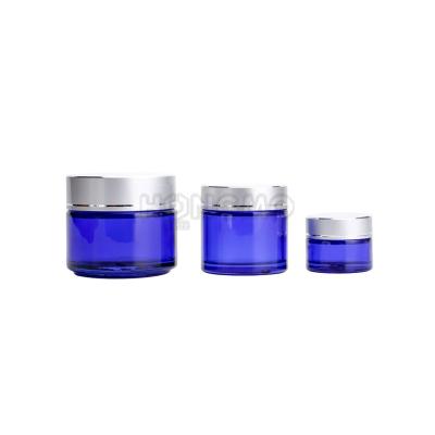 China Cobalt Blue Material Recyclable 15ml 2oz Glass Jars 100ml With Matte Silver Metal Lids For Cosmetic Cream Packaging for sale