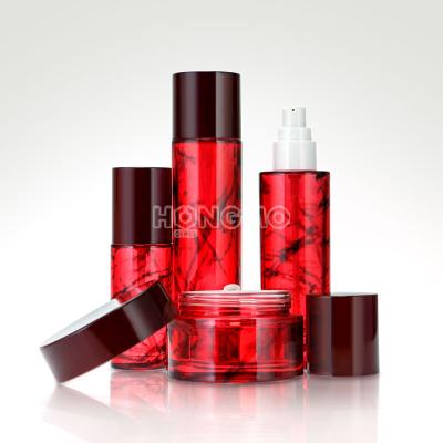 China Customized Material Luxury Red Colored Glass Recyclable Lotion Bottle Pump Bottles And Glass Jars For Cosmetic Lines Skin Care Packaging for sale