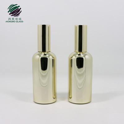 China Shiny gold color personal care champagne pump empty spray luxury packaging UV electroplating UV glass bottles for cosmetics/perfume 100ml for sale