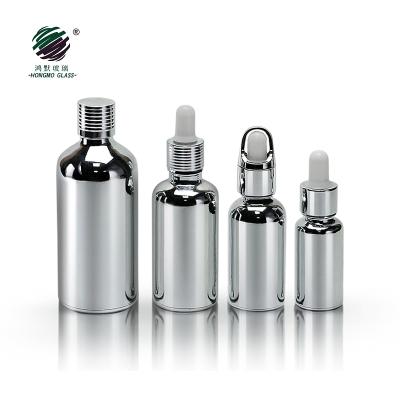 China Recyclable material 10ml 15ml 20ml 30ml 50ml 100ml essential oil electroplating silver gold e glass liquid bottle with silver metal cap for sale