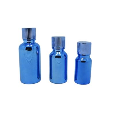 China 30ml recyclable material blue plated empty glass bottle 20ml glass serum essential oil bottle with cap for cosmetic packaging for sale