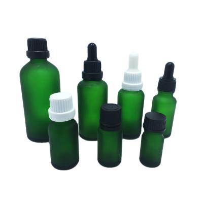 China Personal Care 5ml 10ml 15ml 20ml 30ml 50ml 100ml Frosted Green Glass Bottles With Child Safe Resistant Dropper Caps For Essential Oil for sale