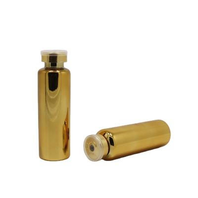 China Recyclable Material Customized Sizes 35ml Gold Plated Glass Vials Bottles With Rubber Stopper And Flip Off Cap for sale