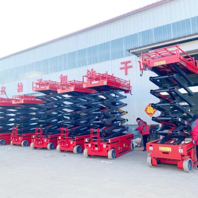 China Hotels Outdoor Application Mini Wheel Lifting Platform Electric Tracked Scissor Lift For Rough Or Uneven Ground for sale