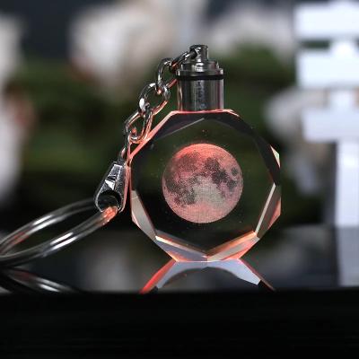 China Souvenir Gift Wholesale 3d Laser Engraving Led Light Key Chain Crystal Planet Pattern Crystal Keychain for sale