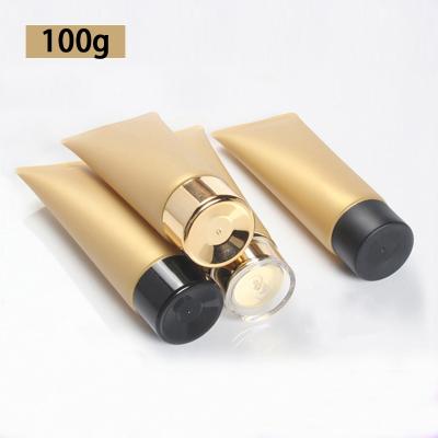 China 100g Cosmetic Tube Empty Plastic Soft Facial Massage Tube Refillable Squeeze Cleansing Cosmetic Tubes With Gold Lids for sale