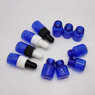 China Personal Care Products 1ML 2ML Small Size Blue Color Dropper Glass Bottle With White And Black Cap for sale