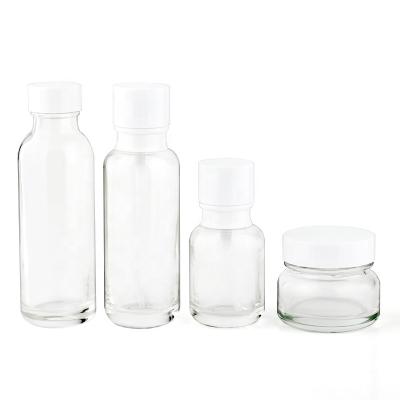 China Base Bottle 50ml Cosmetic Jars 50g Cream Jar Empty Glass Cosmetic Lotion Bottle With Pump for sale