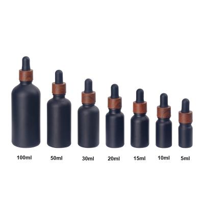 China Essential Oil Dropper Bottle 10ml 15ml 30ml 100ml Cosmetic Black Essential Oil Glass Bottle With Dropper for sale