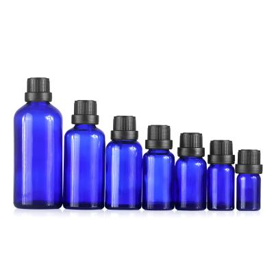 China Perfume Cosmetic Liquid Vials 5ml 10ml 30ml 100ml Blue Glass Essential Oil Empty Bottle With Orifice Reducer And Tamper-Evident Cap for sale