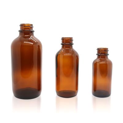 China Amber Boston Round Glass Bottles 1oz Essential Oil Cosmetic Empty Bottle 120ml With Black Poly Cone Cap for sale