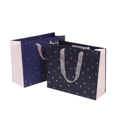 China High Quality Recyclable Custom Color Gift Packaging Paper Bag , Recyclable Paper Euro Packaging Bag With Ribbon Handle for sale