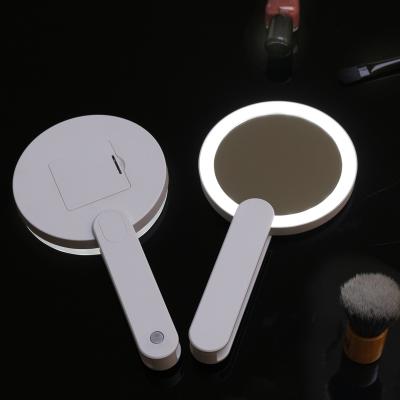 China Mini Handheld LED Lighted Mirror Lighted With Foldable Handle Led Lighted Make Up Mirror for sale