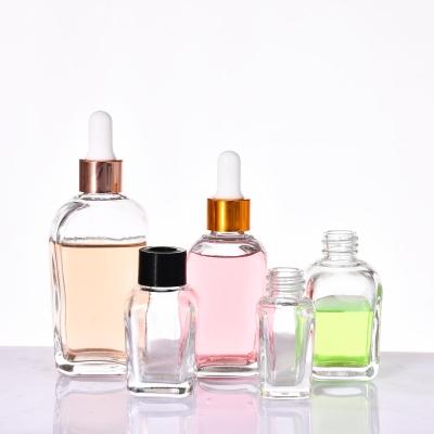 China Wholesale Cosmetic Hot Style Cosmetic Distribution Bottles Glass Transparent Dropper Oil Square Fine Oil Bottle 10ml 20ml 30ml 50ml 100ml for sale